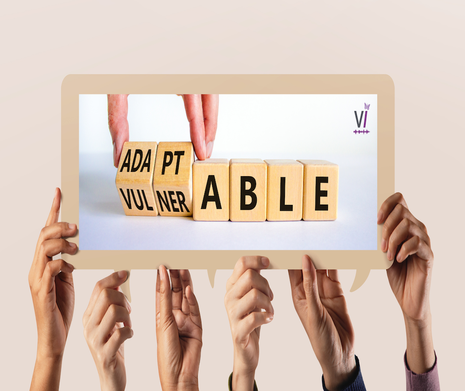 Vulnerability Six hands holding a speech bubble. Inside the bubble is a picture of some blocks spelling out the word 'vulnerability'. The four blocks on the left have been partly rotated to reveal 'adapt' so that the word also looks like 'adaptability'.